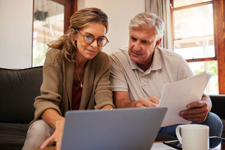 Older couple using laptop