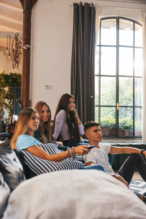 Teenagers watching TV