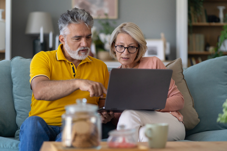 Older couple using laptop at home
